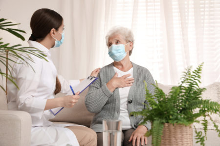 Nurse Cares For Assisted Living Patient In Her Home.