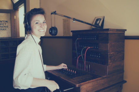 Woman Working At A Medical Answering Telephone Switchboard